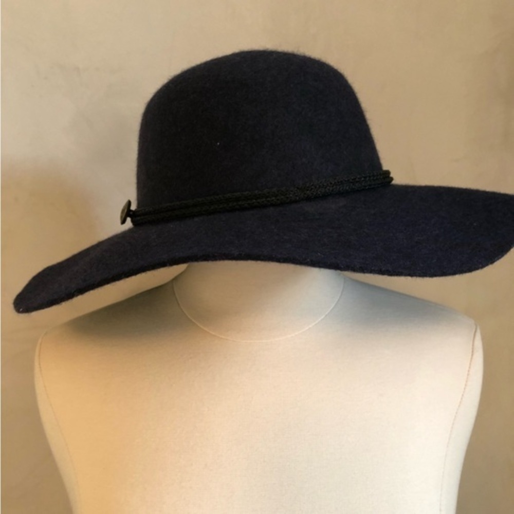100% Wool Blue Bohemian hat with a black rope and metal charm around the rim